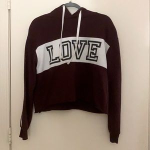 Dark red/maroon medium reflex crop sweater with love across it